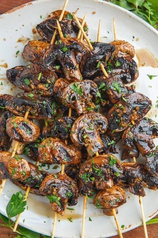 These balsamic garlic grilled mushroom skewers are a perfect addition to any grilled dinner. Marinated in a delicious blend of balsamic vinegar, soy sauce, garlic, and thyme, these tender and charred mushrooms will be a hit with your family and friends. Try this easy and flavorful recipe today! 
