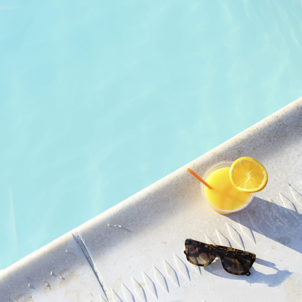A glass of citrus spa water with orange, lemon, and lime slices, one of the simplest hydrating drinks for energy and focus.