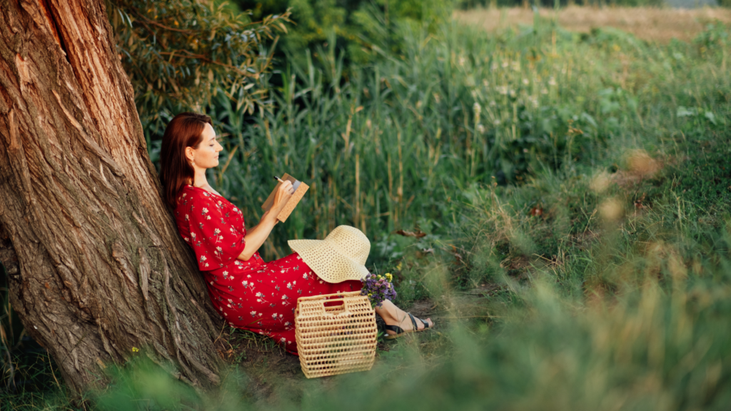 woman journaling in a garden to emphasize mental health and menopause