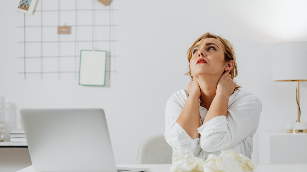 stressed woman while working to emphasize What Are The Five Stress Management Techniques