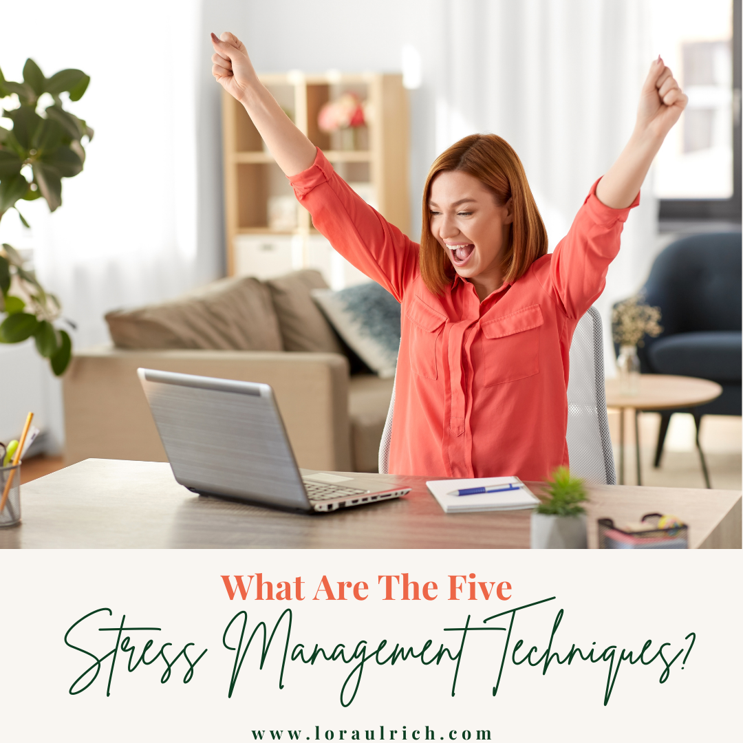 Woman raising her hands in celebration while facing her computer