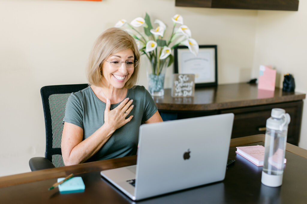 Menopause health coach Lora Ulrich conducting a personalized 1:1 Zoom session with a midlife woman, focusing on hormone balance, nutrition, and lifestyle support