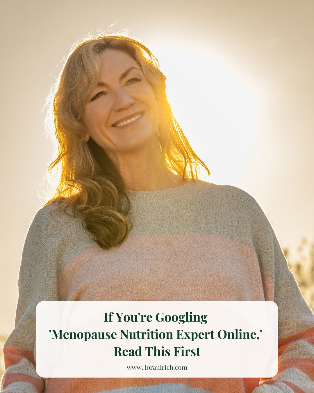 A midlife woman smiling in the golden sunset, reflecting calm, hope, and renewal during her wellness journey.