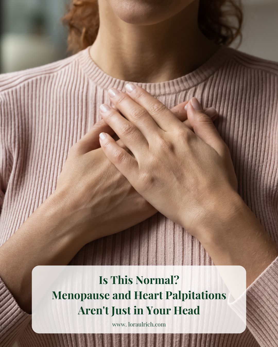 Midlife woman with both hands over her chest, expressing calm and awareness during a heart palpitation moment.