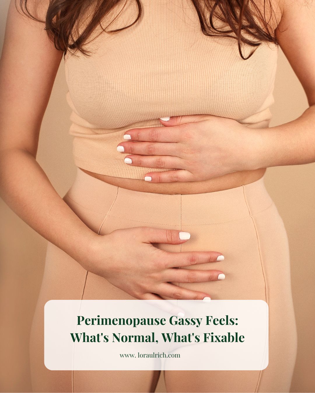 Woman in midlife gently holding her stomach, visual metaphor for perimenopause digestive changes