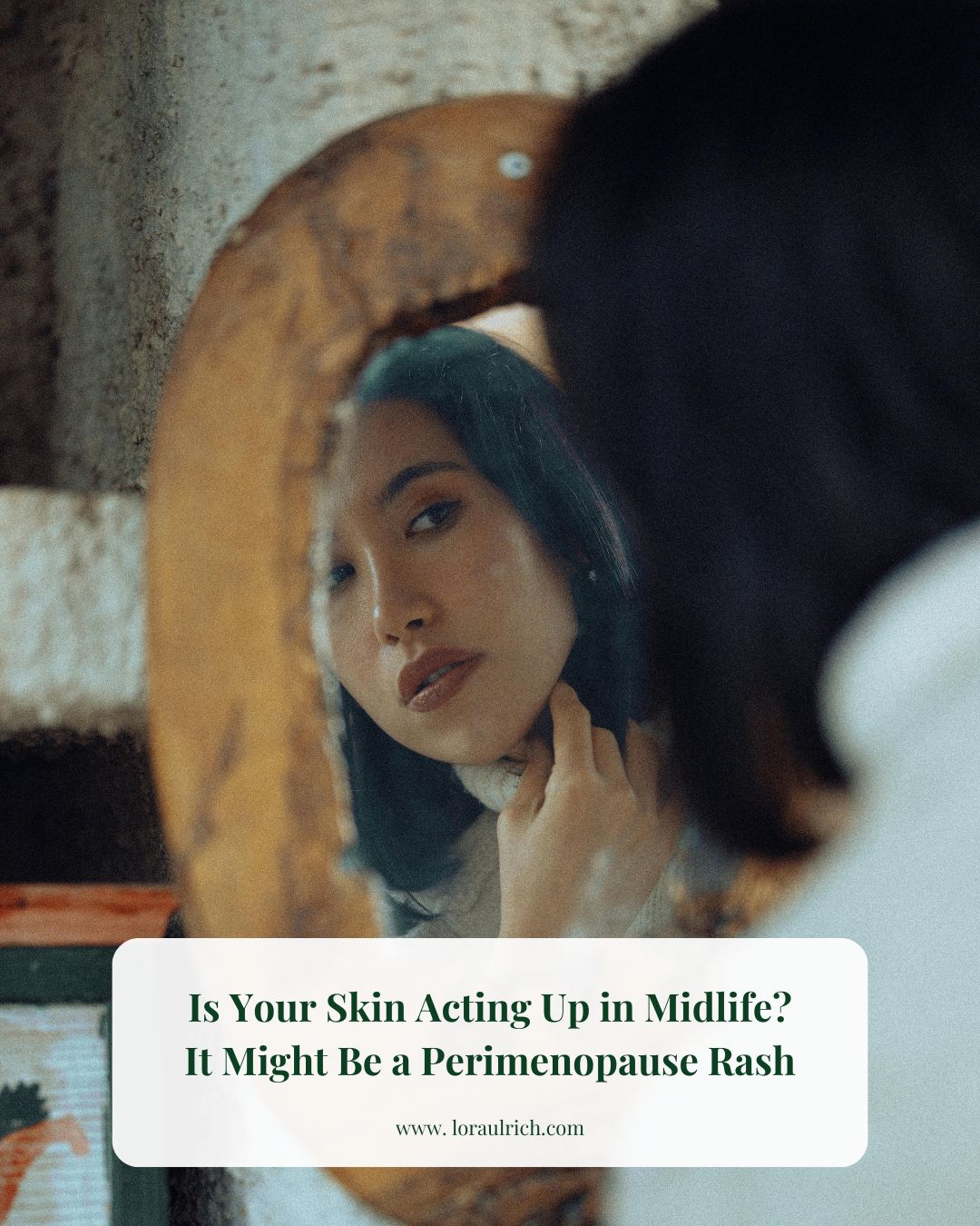 Woman in her late 30s looking in the mirror, gently touching her neck, suggesting skin sensitivity or hormonal changes during perimenopause.