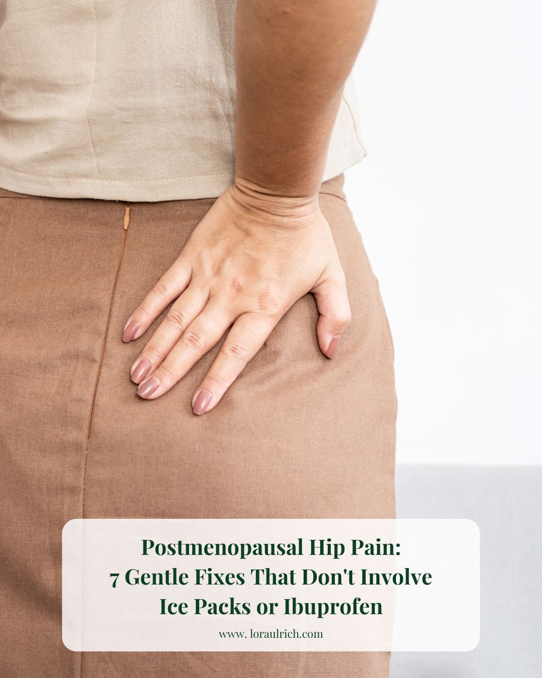 Midlife woman gently holding her hips with both hands, expressing discomfort, capturing the emotional reality of postmenopausal hip pain.