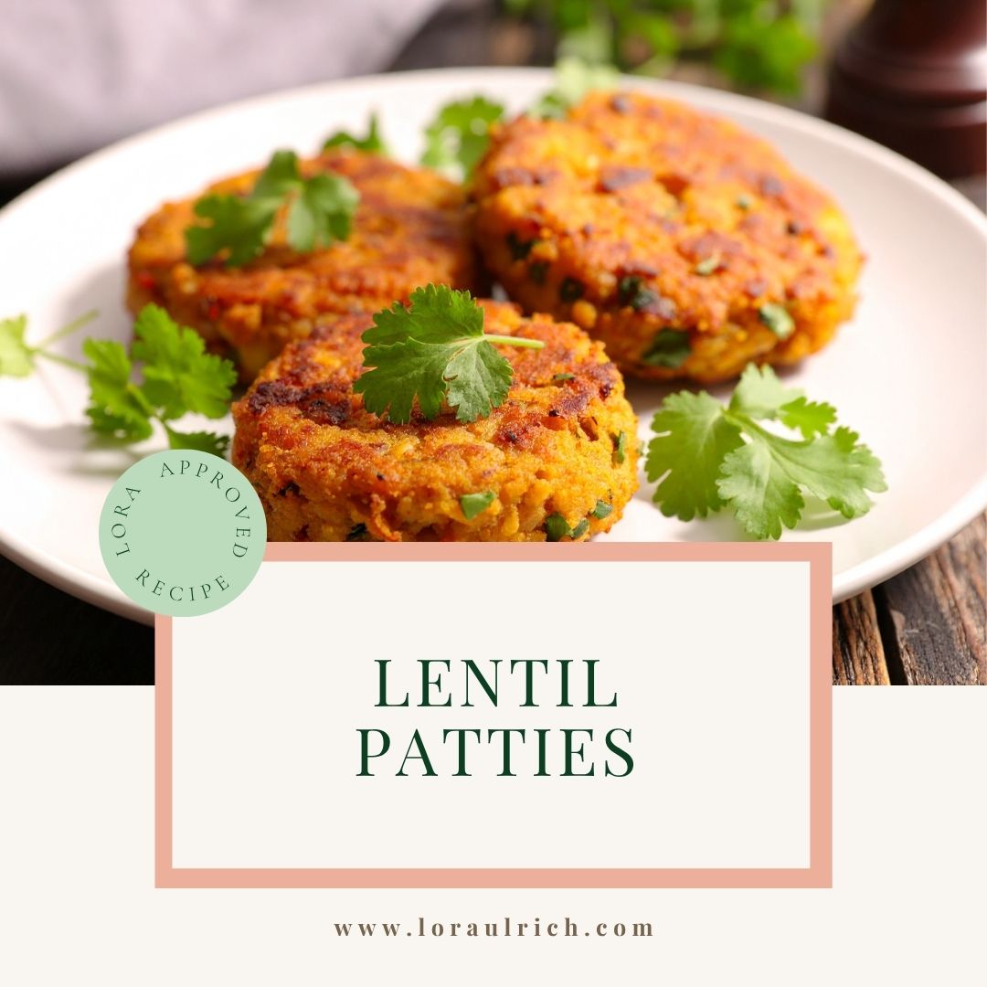 Golden-brown lentil patties arranged on a plate, served with fresh herbs.