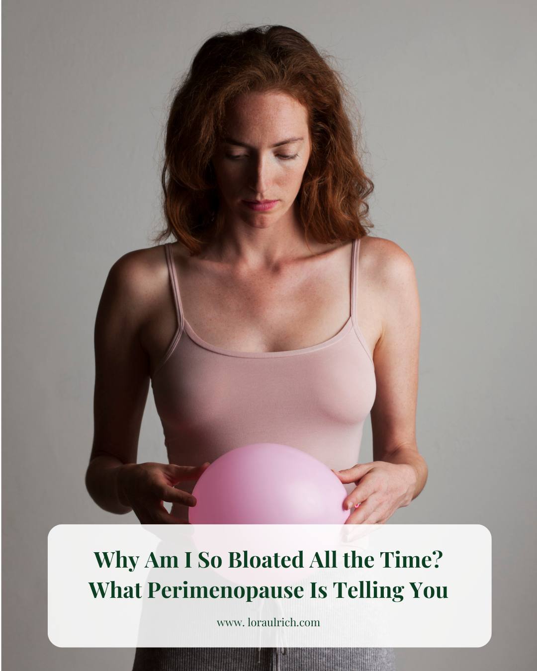 Woman gently holding a balloon over her belly, symbolizing perimenopause bloating.