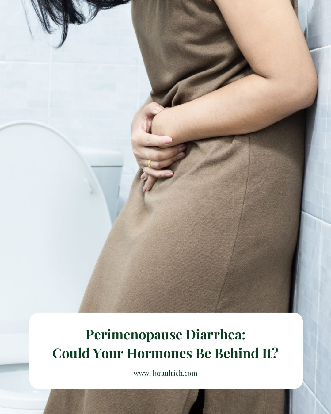 Woman holding her stomach in a bathroom, showing discomfort from digestive symptoms.