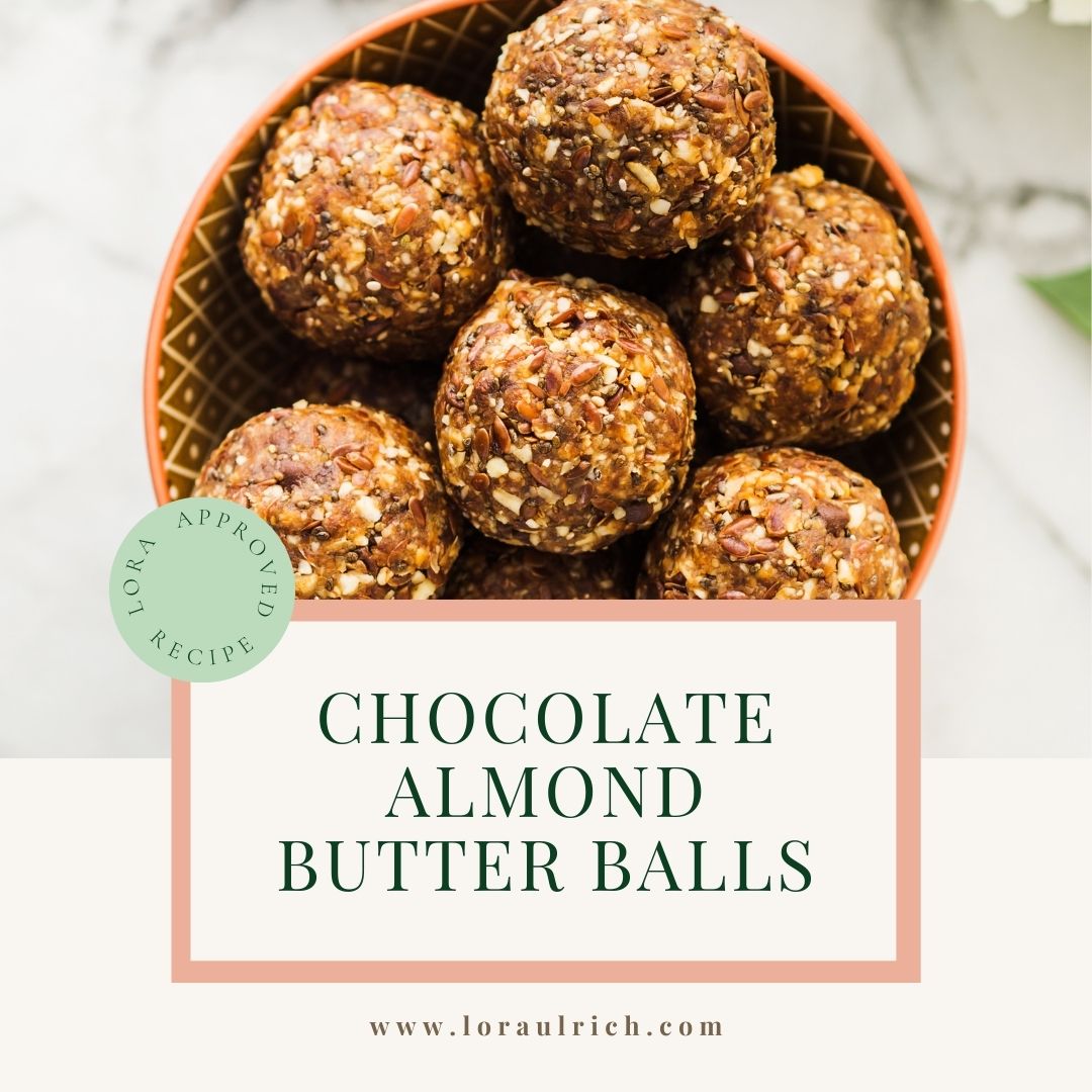 A small bowl filled with soft, fudgy chocolate almond butter balls, chilled and ready to serve as a dairy-free holiday treat.