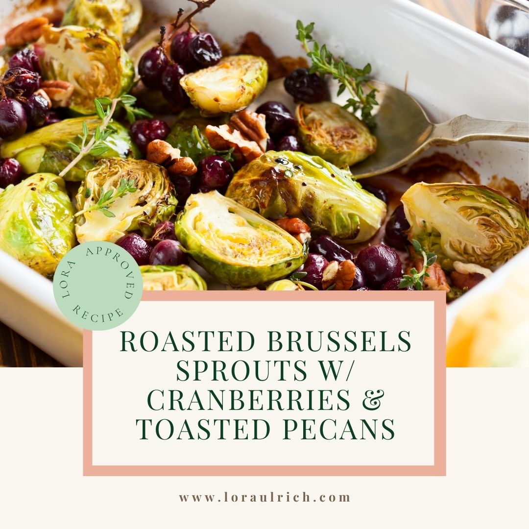 Holiday roasted Brussels sprouts with cranberries and toasted pecans on a serving platter.