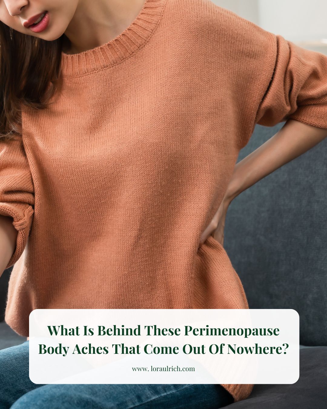 Woman with her hands on her hips, wincing in discomfort experiencing body ache during perimenopause