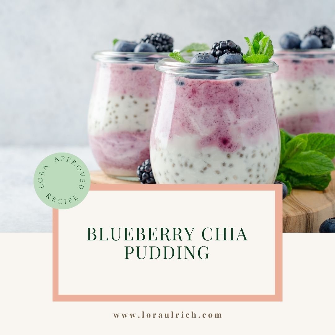 Dairy-free blueberry chia pudding served in a glass jar topped with fresh blueberries and mint.