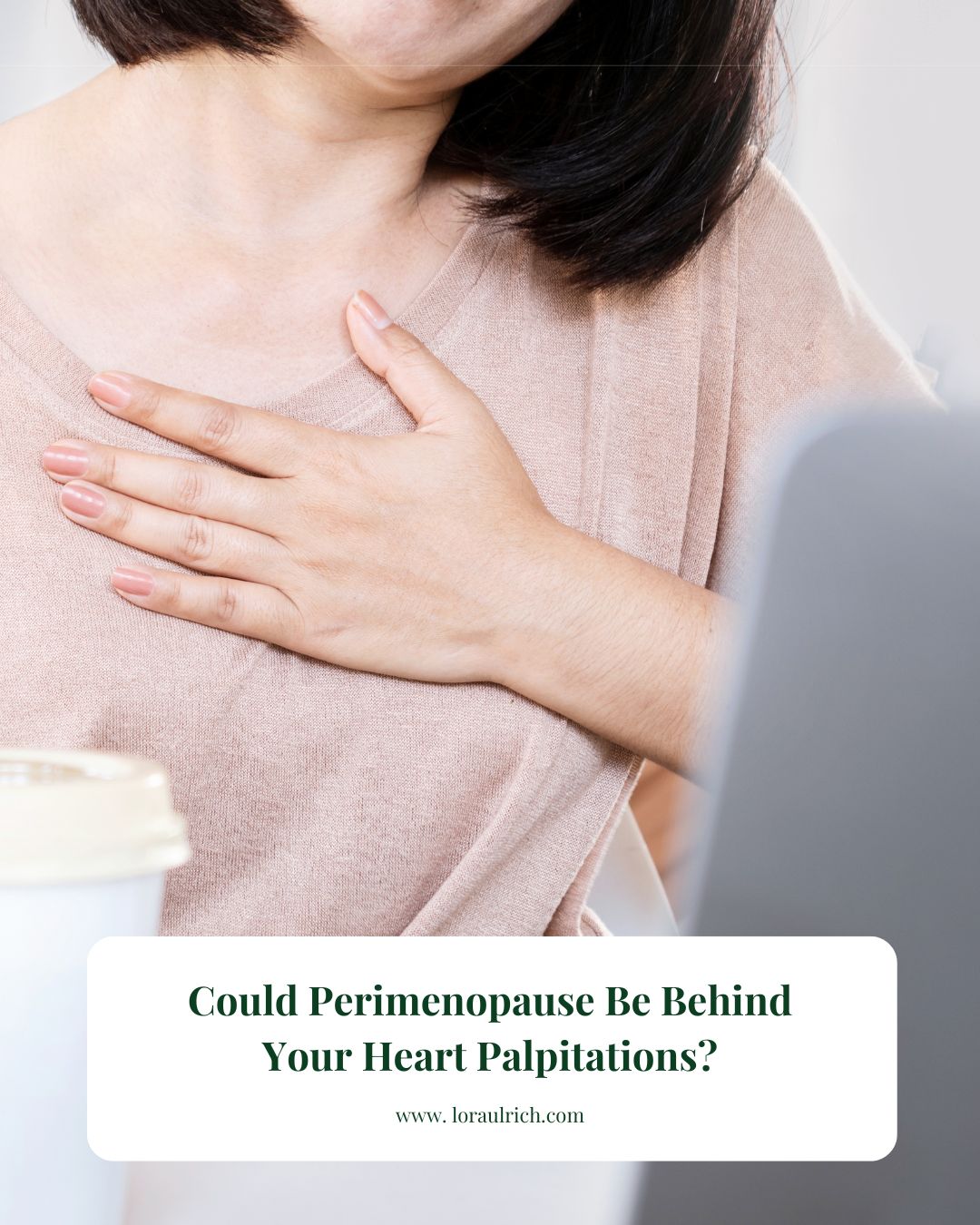 Concerned woman holding her heart, symbolizing perimenopause heart palpitations symptom.