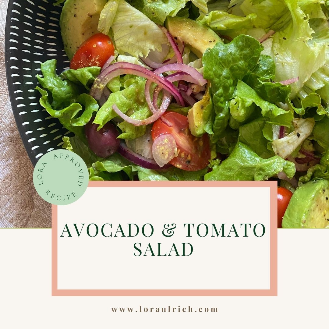 A fresh avocado and tomato salad, featuring crisp lettuce leaves, halved cherry tomatoes, and creamy avocado chunks.