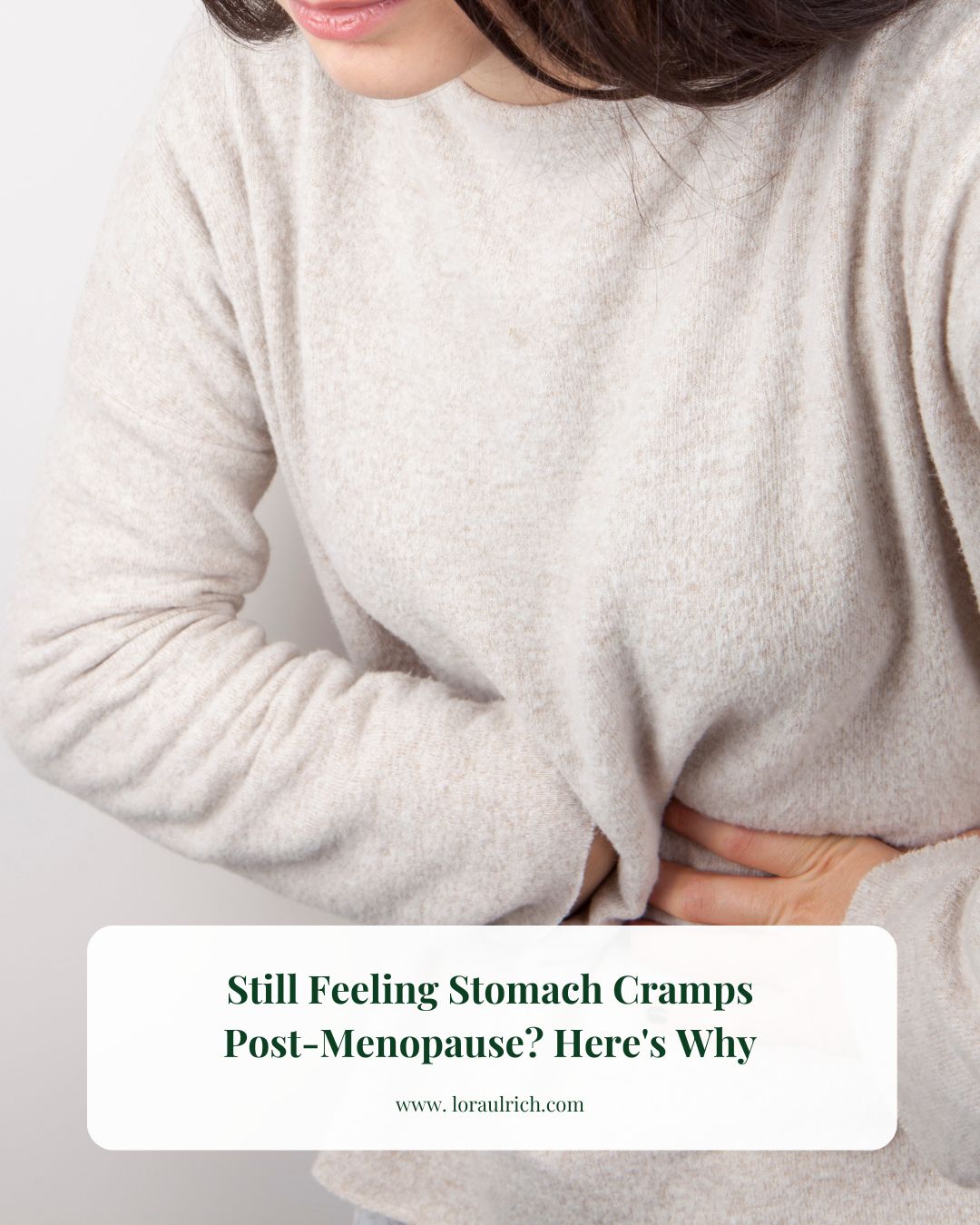 Midlife woman holding her stomach, showing discomfort from postmenopausal cramps and digestive issues.