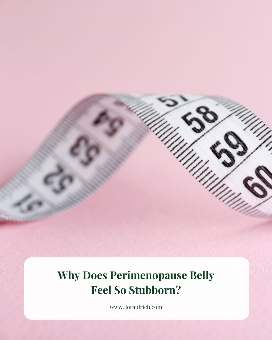 Measuring tape curled on a pink background, used to illustrate perimenopause belly.