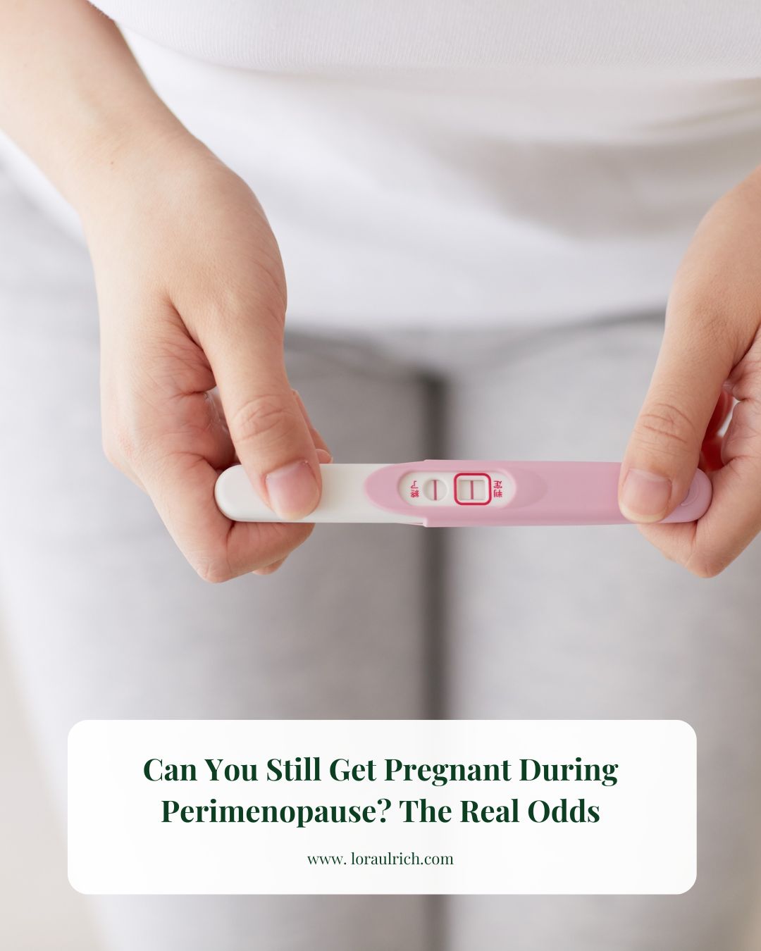 Close-up of a midlife woman holding a pregnancy test asking can you get pregnant during perimenopause.