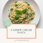 A bowl of creamy cashew cream sauce pasta and greens, a perfect low-glycemic meal for managing energy during midlife.