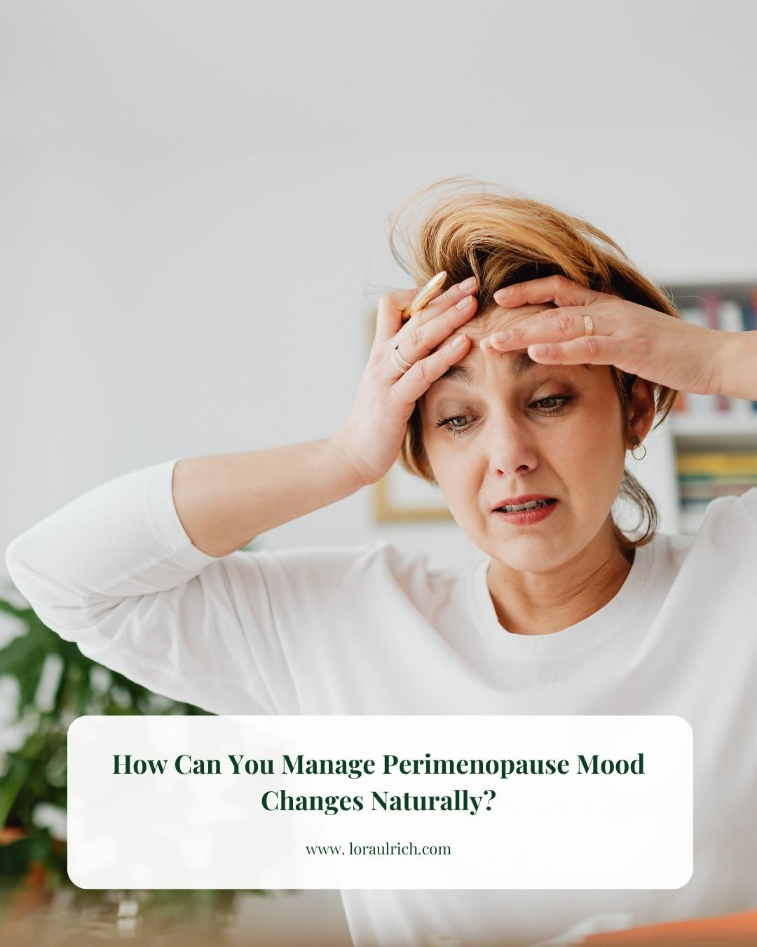 Woman in midlife holding her head in frustration, representing perimenopause mood changes and stress